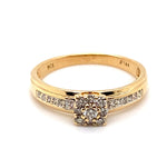 9CT YELLOW GOLD DIAMONDS SET IN RAISED SETTING AND SHOULDERS OF DRESS RING