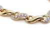 9CT YELLOW GOLD 20CM CUBIC ZIRCONIAS SET IN SWIRL LINK BRACELET