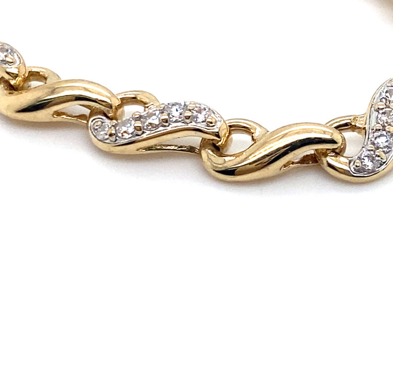 9CT YELLOW GOLD 20CM CUBIC ZIRCONIAS SET IN SWIRL LINK BRACELET