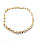 9CT YELLOW GOLD 20CM CUBIC ZIRCONIAS SET IN SWIRL LINK BRACELET