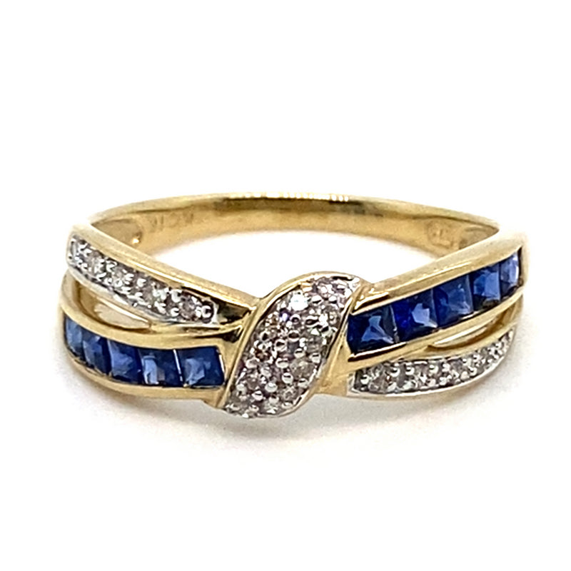 9CT YELLOW GOLD CROSS OVER DIAMOND & SAPPHIRE DRESS RING VALUED @ $1399