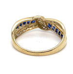 9CT YELLOW GOLD CROSS OVER DIAMOND & SAPPHIRE DRESS RING VALUED @ $1399