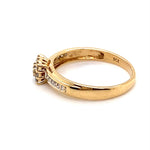 9CT YELLOW GOLD DIAMONDS SET IN RAISED SETTING AND SHOULDERS OF DRESS RING