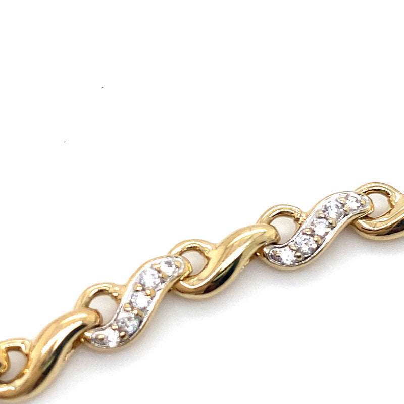 9CT YELLOW GOLD 20CM CUBIC ZIRCONIAS SET IN SWIRL LINK BRACELET